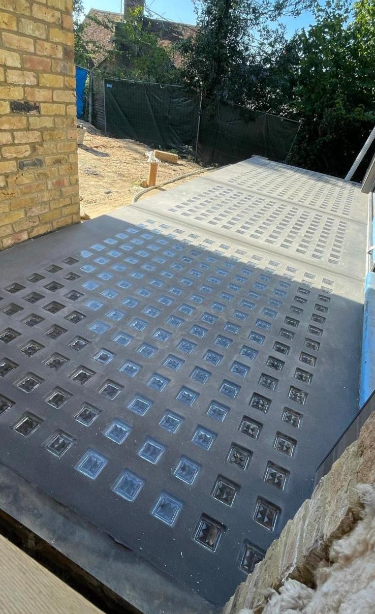 UKP-150-100 pavement light installation showing glass lens grid pattern